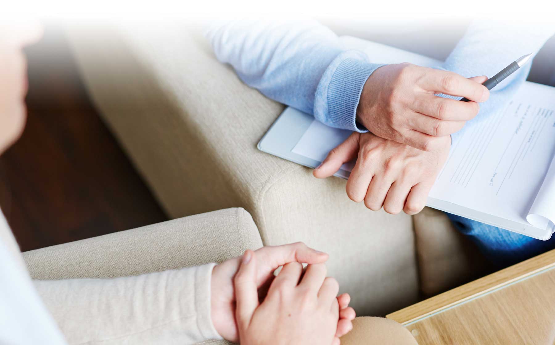 Couple seated with hands cupped